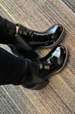 Let me start off by saying these shoes make me feel like I can be a better person even in 2020. But seriously!! Let's hit the highlights shall we:
1. SO COMFORTABLE! No break in time necessary. 
2. Does NOT make loud walking sounds on the floor (I walk like a Clydesdale horse), I could sneak up on someone in these (if I wanted to)!
3. The shiny material is perfect for rainy weather. I did not freak out about getting these wet. (I got the shiny black pair)
4. When I trip on my own feet and make a smudge on them IT WIPES OFF AND IS PERFECT AGAIN! 
5. I usually wear a 7.5 and ordered a 7.5. I would not change it! At first I was worried they might be too loose, but they're perfect. Thick sock or thin socks, they both work great for me with these boots. 
6. Easily my favorite shoe right now. 
7. I may or may not have ordered a second pair of the exact same color/material to have as my back up when I wear these out. 
8. Seriously. I bought a second pair. 

Love, love, love!! - Stormie P.