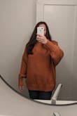 I like the idea of an oversized sweater. However this was purely unflattering on me, especially adding the large cut of the arms. The color is also a bit different in person, more orange; and combined with the cut I felt like a pumpkin, or Velma from Scooby-Doo - not in a good way. Probably cool on a taller, slimmer person. The quality is great, but it has a cold hand if that makes sense, doesn't feel warm and cozy though it is very soft. Anyway, I like Lulu's, and especially seeing everyone's helpful reviews. Hope this helps! - Kate B.
