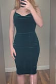 This dress is so stunning and sexy. I have received so many compliments on it and it fits really well. The material is thick enough that I don't feel the need to wear a bra in the dress. I do plan on investing in skin tape for the cowl neck line because if I bend over it is revealing, and would be too revealing even if wearing a bra. Like other reviews have said, you can scrunch it up in a natural looking way where it would lay above the knee. - Riley B.