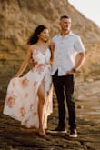 This dress is absolutely gorgeous and a dream to wear for our engagement photoshoot. Love the pattern, the flow, and the slit down the front! I had it tailored to be shortened by about an inch and also had bra pads placed in. - Hannah H.