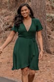 Purchased this dress for our Christmas pictures and it was the perfect color for winter pictures. The dress was so flowy and wrapped around the waist perfectly. The dress was low cut but I knew that when I purchased it. I had to wear an under shirt and a pin it. Just because I didn't want to be showing a lot in our pictures. Definitely would recommend. - Helen U.