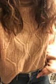 I love this sweater! The color is this rich and unique muted blush. Looks great with a light wash Jean and brown boots. Normally a size M, but could have gone down a size if I wanted a less-loose fit. It's cropped, but hits at the PERFECT spot near the top of my hip bones. Just the right size for tucking the front into my high waist jeans for that cute & comfy, stylish look. - Desiree S.