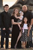 I bought this dress for our family pictures, and I am still a bit conscious of my post partum Mommy pooch. This dress hid any imperfections nicely, wasn't too low cut (although I did use fashion tape just in case) and the fabric is fairly thick so it's not see through. It's a great dress and worked perfectly! I felt great wearing it. - Jacqueline G.