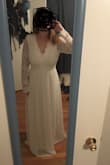 I ordered this dress to try on as a potential wedding dress. I'm typically a large, size 10 in most clothing. I ordered both a M and a L in this dress, and I actually prefer the large. I have slightly broad shoulders, so the large gave me more room to move my arms around. The medium was also a little tight around my rib cage, although I could zip it. The sleeves were baggy on both dresses and would need to be taken in. I would also need to have several inches hemmed off the bottom. Im not crazy about the fit of the top (its a little frumpy on me as is). But I think with the right bra and some neckline alteration, this could be a very flattering dress. The quality of the material is very thick and comfortable. It seems durable and would hold up to a night of dancing. Overall, a great wedding dress contender! - Erin T.