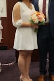 My husband and I did a small wedding at the local courthouse while we work on planning our big ceremony. This dress was absolutely perfect. Casual yet elegant and classy. Perfect length as well! - Yaya J.