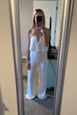 I was nervous this wouldn't stay up but it holds up just right. I bought this for my bridal shower and can't wait to wear it! It's a tiny bit long but I plan to wear heels with it anyways. - Jalen G.