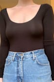 I've been looking for a black bodysuit to wear with some of my high waisted pants and jeans. Luckily, this one goes really well with jeans, mini skirts, and pretty much anything you can think of. Can be worn with or without a bra. The material is soft and the style is flattering! - Madeline M.