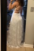 I'm usually a medium in dresses, but I sized up and it fits perfect! This is my wedding dress I'll be wearing and I'm so happy with it, the moment I tried it on I fell in love, the back is beautiful, the pictures don't do it justice - Vanessa C.