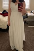 I thought it was a great dress. I'm fairly short, so the dress would have needed some tailoring. The fit was very flattering, it gave the illusion of a slim waist. Quality material as well. My mom just thought it was low cut! - Olivia Y.