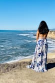 I love how it fit me, don't worry about the backless, it's not too low, so nothing to worry. It's a beautiful beach dress. - Varsha V.