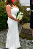 This is the 3rd dress I bought for my elopement. Yes 3rd! I returned the 1st ($500) after a day because it was completely see through and the 2nd ($300) was not like the picture then I found Lulus and they had an amazing selection with great prices. They give great and accurate measurements of the dresses. I pick one and it arrived as pictured and faster then estimated.
I ordered a large. I had to hem the front 4 inches, shorten the straps 1 inch and take in the waist & hips 1 inch on each side. I would have fit a medium however I am fuller on top and needed the room of a large. It was soft on the inside and beautiful lace on the outside. It was perfect for our beach house elopement. The top front has a thin rubber strip so it doesn't move around. The bodice is well stitched so the dress sits in the right place and doesn't bunch or ride up. The back lace is pretty and the straps are sturdy. I added a glitter belt to glam the dress up a little more and to help give me a waist. - Jami T.