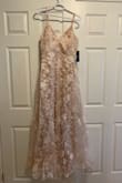 I ordered this dress as a bridesmaid dress for my sister's upcoming wedding. It is SO pretty! It is a pale pink/peach color and the overlying lace has some sparkle to it, which I wasn't expecting. I am quite petite so I will have to hem and take it in a bit, which is fine. Better than my expectations! - Chelsea G.