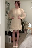 I wore this dress for my zoom wedding ceremony (lol) and I love it. It's nice quality and photographs greats. It looks very vintage, and is a true cream color. It was a bit big but I liked that it didn't hug skin tight. - Lauren W.