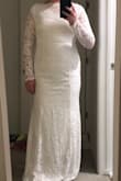 This dress is AMAZING! It is so comfortable because it's all stretchy material. It looks whiter than in the picture, which was good because I wanted a white dress, not ivory. I ordered an XL, but it was slightly too tight, more than the photos show. I'm not usually plus size, but I think it runs small due to the stretchy material, and also I wanted mine not to be skin tight for my religious ceremony. I have ordered a 1X and can't wait to try it on! Also, I would say that if you want the dress to look more off the shoulder, you can easily do that since it's stretchy, but if you want it to cover your shoulder more, that is also easy, depending on your body type. - Lindsay P.