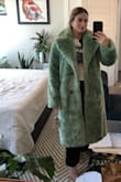 This is incredible quality and the lining is so smooth and cute, but do not purchase if you are under 5'5. It will SWAMP you. Also, the collar/lapels just feel way too large. - Mary M.