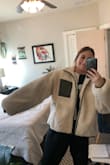 It's a comfy sweater, but way too big. I would've gotten a size down, but I feel like the sleeves would be too long regardless. Don't buy unless you're over 5'4. - Mary M.
