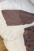 I originally ordered the cream color in medium. I wanted a looser fit, so I returned for the large in taupe.
I regret not trying it on before pulling the tags off and wearing it to the office.
The sleeves/wrists are so loose and stretched out. It looks so silly. - Cynthia G.