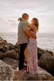 I wore this dress for a photo shoot and am in love with the results. I love the ruffles with the high slit. The tie back makes it easy to adjust to your size as well as looks very flattering. - Felicia S.