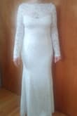 The material is very flexible and light weight. It is very soft and easy to move around even with the sleeves. The pictures on the model make the dress look like it is a cream or light tan but the dress I received was a nice bright white.  If you are looking for a dress with sleeves, I'd highly recommend this one. The length was also perfect! - Kimberly H.