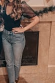 The cutest top, I am in love with it! Especially perfect for the holidays. Fits true to size. I got a M. - Callie R.