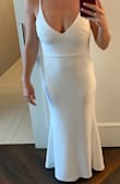 I ordered this dress last Minute for our wedding. Our reception was cancelled but we had a very small group hang in our hotel room and I wanted something more manageable than my wedding dress and this dress was perfect!!! I needed to hem it quite a bit but it fit everywhere else and was extremely comfortable but looked dressed up! I added a crystal belt to elevate it just a smidge more! Highly recommend! - Shannon V.
