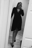 I loved wearing this for my work's Christmas party! The V is definitely deeper than I expected it to be. I ended up pinning it in several places to avoid feeling so exposed. I also had a hard time deciding between a M and L because I'm usually a 8/10, but the M fit really well! - Emma P.