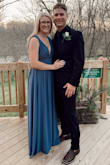 This dress was perfect for a winter wedding. Very nice, thick fabric. I got this dress in a medium (I normally order everything in medium) but I probably could've gotten away with a small. It fit my waist but the top was a little big. I had to keep adjusting the shoulders from sliding all night. Also, this dress is LONG! I'm 5'8 and wearing 4 1/2 inch heels and it still touched the ground. - Kellyann S.