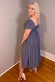 I am 5'3 and a 32DD and size S fit perfectly. The dress is very flattering on curves and the bust is adjustable which is perfect. - Kayla C.