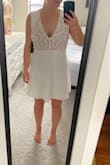 I am a true "smedium" (right between a small and medium) so I always scour the reviews before buying. I chose a small and it is ALMOST perfect. Since I am shorter, I may get the shoulders taken up a little. It's a little snug in the waist so I may pair with spanx. I'm planning to wear it for my bridal shower or rehearsal dinner!
**EDIT** I ended up returning. Upon further thought, I decided to find something more flattering for my body type. - Courtney S.