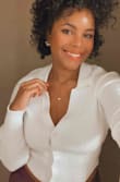 Love this top. I have the brown as well. Pulls a little at the bust for me but I sized up so it's not as bad as it could be. Get it! You won't regret it! - Joelle H.