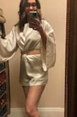 I have been looking at this romper for a really long time and finally bought it. I would say it fits a little big but I don't think I could size down to a 4. The length is perfect, not too long, not too short. Will look great with heels or OTK boots. The sleeves are really long and it's slightly big in the top at the shoulders. But not too bad. It's really pretty and high end. My husband loves it on me. - Angela L.