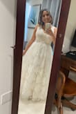 The dress came in a more off white/cream color than the white in the picture. I bought a couple other dresses for my backyard wedding from Lulus that just didn't feel right to me. Once I tried this one on I fell in love! I'm on the shorter side so I had a family friend hem it as well as take up the straps. Other than that, it was perfect. I had gotten very many compliments on it. The dress has a peal belt so I wore some pearl earrings to tie everything together. - Athena E.