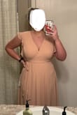 This is a bridesmaids dress in a friends wedding, which by looking at the sites photos of it, make it look great! I first ordered my usual size large, and thought it was too deep on my chest, and when pulled tighter, then became uncomfortably tight and it still came apart too low. I ended up sending it back and ordering a size up hoping that the extra fabric would help me out. The Xlarge is essentially the same dress, deep cut, uncomfortable if you try to tighten it up, and still ends up being able to see my bra. I think this dress would fit much better on smaller chested ladies. Being that I have no choice but to wear the dress, I'll be looking into some double sided tape options to put the fabric where I want it... and I'll be getting a tan. - Karina L.