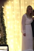 We had to postpone our wedding twice due to COVID restrictions. When we got word my son who is in the military was being sent overseas we knew we needed to make a wedding happen fast so he could be here. We threw together a micro living room New Years Eve Wedding and I found this dress and thought it would be perfect.  I was right! It fit great (maybe even a bit big but I had lost weight after ordering), the fabric is beautiful and flowy. I paired it with a sparkly belt for a little glitz and it was a great addition. I got a ton of compliments, but most importantly my now husband loved it and I felt like a princess. - Jamie P.