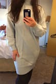 This is a nice oversized sweater dress. The length was an inch above the knee on me. I like how the fabric is more snug at the bottom providing a bit of shape. The collar is quite snug and the dress leaves your curves to the imagination so keep that in mind. - Kendra T.