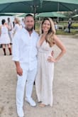 Needed this for a white party. The medium fit well, slightly loose in the waist/stomach. If I were an inch taller it would have been riding up my backside lol. I wore flats and the pant leg length was perfect. Very flattering in the bust area. Got lots of compliments! - Kelly S.