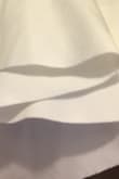 It looks like a white sheet. It's is poorly sewn especially around the shoulder piece. The cut is not clean. It's literally like they took scissors and cut it. I was NOT happy after paying this price. Would like a full refund! - Xorla O.