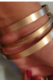 Two of the bangles are round/circle/flat while the middle has a "bent in the middle, all the way round" shape. The exterior is slightly frosted gold while the inside texture has more of a gloss/shine finish to allow for easy slip on. Can't wait to wear these out to complement a cute/classy fit! - Misha P.