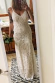 I bought this dress for my small outdoor wedding in March. I tried on several dresses, and this one was stunning. It really glides across your body and fits true to size. The lace pattern is gorgeous and the little train really makes it feel bridal. This dress felt better constructed than ones I tried from bridal stores, and at this price, it is unbeatable. I can't wait to get married in this! - Ashley O.