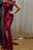 The material is very nice, definitely feels like a $200+ dress. The fit is super flattering. The ruffle detail is beautiful. I wore it as a guest to a formal wedding and got so many compliments. I can't wait to have an excuse to wear it again! - Brittani K.