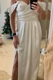 This dress is great for a more casual bride looking for a nice dress. It's flattering and a good material. It can get wrinkly though! I have steamed twice. Busy runs a bit big- I'm a true size 8 and got a large and will need to get altered. Don't know if I will be keeping but still a solid 8/10. Also a bit long. I'm wearing 3 inches heels and will still need alterations. - Lauren M.