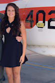 The material is stretchy and comfortable. Gaps a little in the chest but not too bad. Flattering. - Abigail W.
