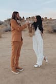 I used this for my desert themed elopement. The pants were a tad short and flared but with short kitten heels it didn't look bad.  I would have tried a smaller size to see if the crotch area fit a bit better but was concerned about the length of the pants... Overall though it's a great piece for the price! - Elizabeth R.