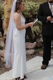 I loved this dress! Wore it as my elopement wedding dress in the spring in Vegas. Since I'm so short, I had to have like 6"+ cut off the hem and altered. My seamstress also let out a very small section around where the top is attached to the skirt - she let out the seam along the zipper here, which just made the dress easier for me to zip up. It was just about half an inch too tight for me. Otherwise, this dress was perfect! The material is super forgiving and smoothing! Scuba-esqu. Comfortable all day! I suggest a pair of stick on pedals for the "girls" as well. I am basically built like a Mini-fridge, but this dress gave me a figure and made me feel so confident and sexy on my wedding day! - Tayler V.