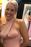 I ordered several dresses from lulu -I was a close friend of the bride so needed something vaguely bridal party-ish.
I am UK 57kg, and 30f bra size.
The dress is really easy to style = you can find something to suit your shape/look. With several bridesmaids it would mean built-in flexibility. There is a demo showing ways of how to style and you can come up with your own too.
I had thought about cutting the excess material once I had decided on a style as there was a lot/too much to play with. But cutting could have restricted use if I wanted to style it differently on another occasion.
The way I had this mean I couldn't wear a bra. I had stick-on cups but I find they are pretty useless, so tying under my bra-line / empire line helped but no vigorous jumping on the dance floor and there was some 'drop' of boob-pertness!!
Material is really nice and has stretch/give falls well but the nature of the sheen means it does show some of your excess bumps (most of us have 'em). You could always style it differently! - Nancy B.