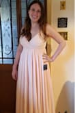 The waist of the dress hits me a bit differently than the model; it cinches in just below my chest instead of coming down to my waist. It feels more like an empire waistline. The dress is beautiful and great quality, but it's not quite the fit I was looking for. - Kelly F.