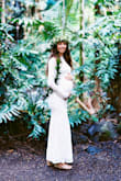 My fiancé and I got engaged in March, COVID hit, and we postponed planning a wedding. Then I got pregnant and at 8 months pregnant in December of 2020, we decided to stop postponing and get married, just us, and have a party with family and friends someday in the near future. I still wanted to wear my dream wedding dress (form fitting, long sleeve, lace, high neck line) but living on a rural island without being able to travel to try on dresses, had no idea what to do. I found Lulus.com and through the chat, they helped me find exactly what I was looking for. I also needed something with fabric that was stretchy enough to accommodate my rapidly growing belly! I ordered three dresses that they suggested, expedited shipping, and this one fit perfectly. I returned the other two without any problems whatsoever and my now husband and I got married a week later. Everyone keeps asking where I got my wedding dress. I'm going to save it to wear at the reception we'll have in the future <3 - Seana W.
