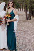 I bought this to wear as a bridesmaid for my sisters wedding. I was so happy with it right out of the bag and the green is the perfect shade. The material is thick and comfortable, which was great because I wore it without a bra and didn't have to worry about showing too much. The material also helped give it more of a flattering fit as well, hugging all the right places. It is super comfortable and I was thrilled it was long enough for me to wear with or without heels, as tall as I am (between 5'9" and 5'10"). I realize the adjustable straps makes it easier to fit multiple chest sizes and heights, but they do get twisted easily, so that's the only downside. However, it's an easy fix to take it in and get them tailored. One of the other bridesmaids also wore this dress. She is 5'4" and got an XS. She had to get the dress hemmed but it looked just as great on her! - Rudi S.