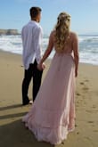 I absolutely love this dress! I used it for my engagement photos and it was perfect! Tightens in the back too to adjust to anyone's size. Very true to size. It was a tad long but it didn't bother me at all. Super flowy! I loved it! Random fact may or meat not be useful but I was worried when I laid in the sand at the beach I'd ruin it or it was get all wet and sandy but it didn't get dirty or leave marks or sand on it. The material is actual magic! - Kat P.
