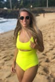 I absolutely love this swimsuit. I usually am a bikini person, but I have been searching for years for a flattering/sexy one piece to wear for days when I don't want to suck in or eat and drink a lot on the beach lol. I ordered this for my trip to Hawaii right after the holiday! This swimsuit is exactly what I imagined. The neon yellow is so fun and the suit is so soft and stretchy. I usually am a Medium or size 2/4. I ordered both the M and S and ended up keeping the small. If you are between sizes I would size down. It does loosen up a little when worn and in the water. I do agree with other viewers that it is a little thin. You can see my nipples and possibly even the aureoles in certain lighting. However, that doesn't bother me. If you concerned with that just get it in black. The only thing that would make this swimsuit better is if the straps could be tightened. While it fits me and I have worn it several times, I probably will have a seamstress take an inch off the straps for a little more lift up top. - Victoria S.
